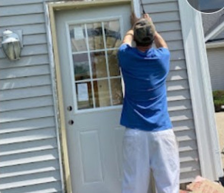 BGK handyman working on an exterior door
